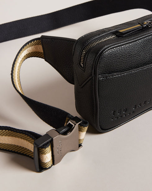 FABE-Bags-Introducing FABE, the faux leather belt bag that combines style and convenience in one sleek package. This hands-free hero keeps your essentials by your side whether you're exploring a new city or dancing the days away through festival season. Belt bag Faux leather Adjustable webbing strap Zip fastening Side release buckle Dimensions: 5cm x 12.5cm x 22.5cm- Ted Baker Romania